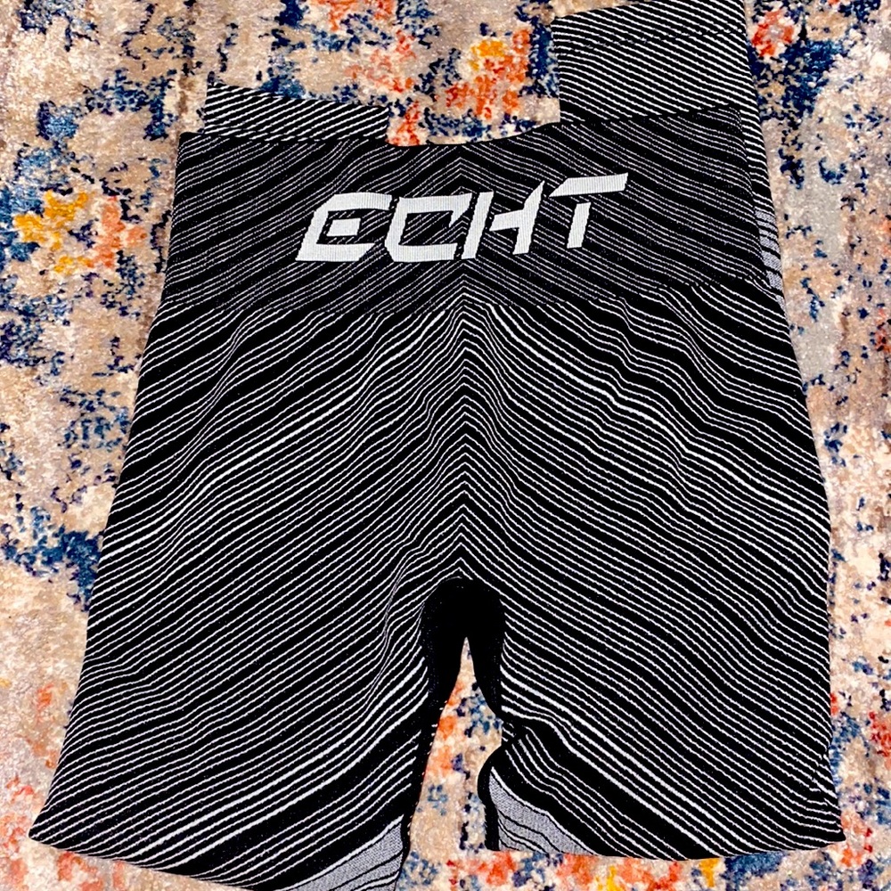 ECHT seamless leggings in fun gray and black striped design. NWOT